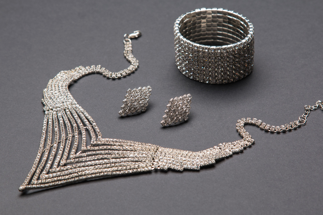 Beautiful women's jewelry on gray surface